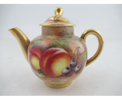 A Royal Worcester miniature tea pot by Roberts height 3.25ins  Condition Report:   Good condition, no signs of restoration, c