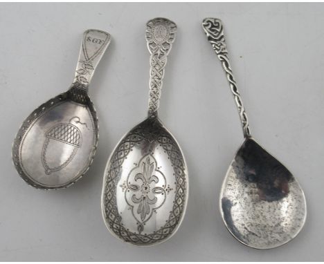 A silver caddy spoon, with Celtic design to the handle, maker&nbsp;Amy Sandheim, together with a Georgian silver caddy spoon 