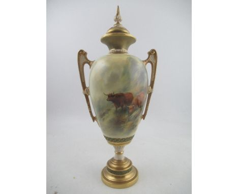 A Royal Worcester covered pedestal vase, decorated with Highland Cattle in landscape to the front and vignette to the reverse