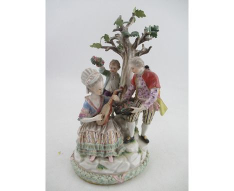 A Meissen porcelain figure group, with a seated lady playing a lute, a man offering flowers in his hat and a child offering a