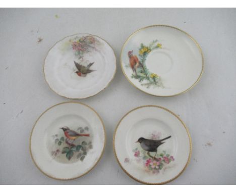Two Royal Worcester miniature plates decorated with a Red Start, Black bird, Robin and a Linnet by Powell diameter 4.5ins tog