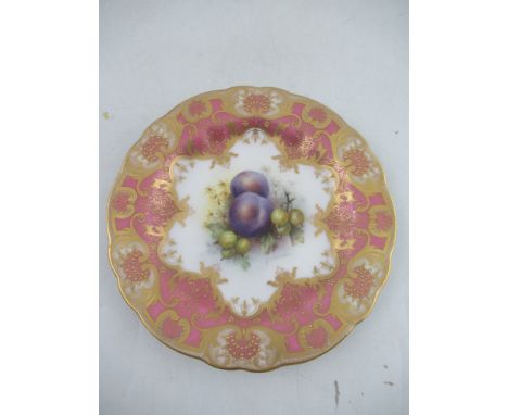 A Royal Worcester plate decorated with damsons and gooseberries to a pink gilt richly enameled border, signed Sebright,  heig