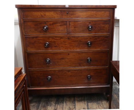 A North Country Victorian mahogany tall chest, circa 1860, with a shallow frieze drawer above two short and three long drawer