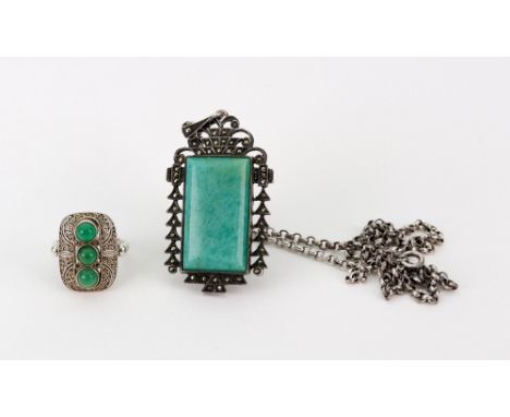 An amazonite and marcasite pendant, stamped 'Sterling Germany', on chain and a small green chalcedony cabochon three-stone ri