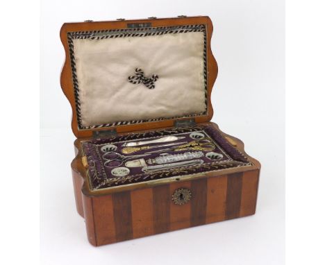 A French satinwood rosewood banded gilt metal mounted sewing box, circa 1830, of rectangular form with serpentine ends, the h