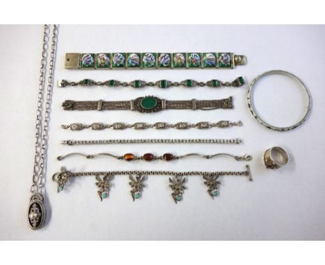 A collection of silver and white metal jewellery to include; a Persian enamelled panel bracelet; a floral enamelled slave ban