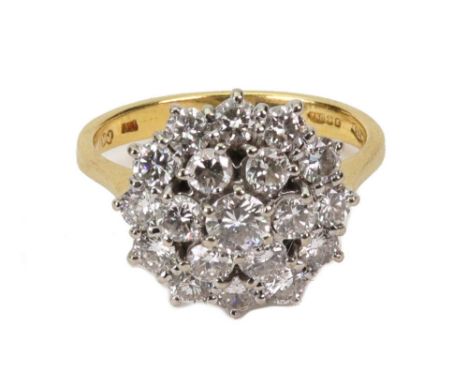 A modern 18ct gold and diamond cluster ring, the 19 round brilliants approx. 1.46cts total, claw set in a white 'tiered' moun