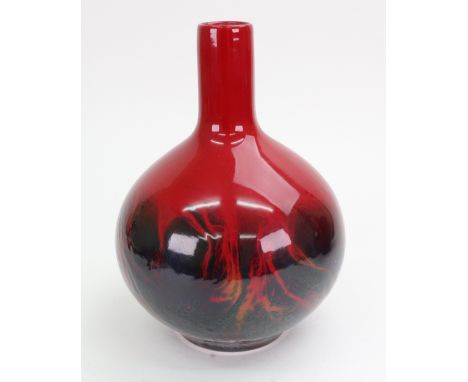 A Royal Doulton flambé veined bottle vase, post 1970, with a thick speckled blue/grey running glaze on a red ground, printed 