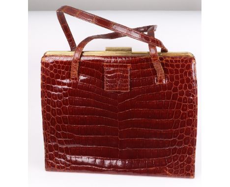 A vintage Asprey crocodile skin handbag, circa 1960s/70s, with fitted interior, original coin pouch and mirror, 24cm wide.