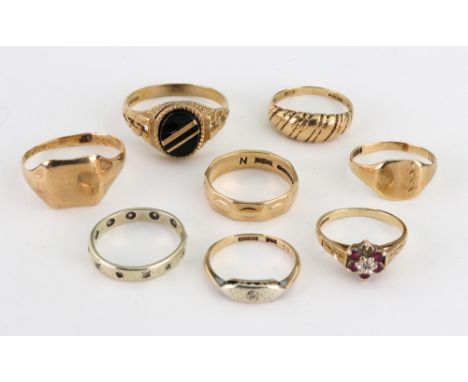 A group of eight mostly 9ct gold rings; including an oblong signet ring; another set with an oval black onyx; a small ruby an