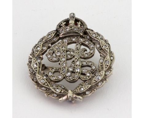 A 9ct white gold and rose-cut diamond brooch, Birmingham 1949, by Garrard & Co Ltd., formed as a monogram in a garland with r