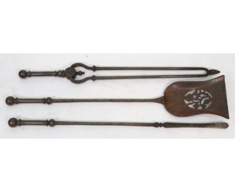 A set of three Victorian steel fire tools, with turned cylindrical stems and spherical finials, the shovel 73cm long.