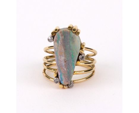 An opal veined matrix and diamond abstract ring, circa 1970, on four section shank, ring size M, 7.4g gross.