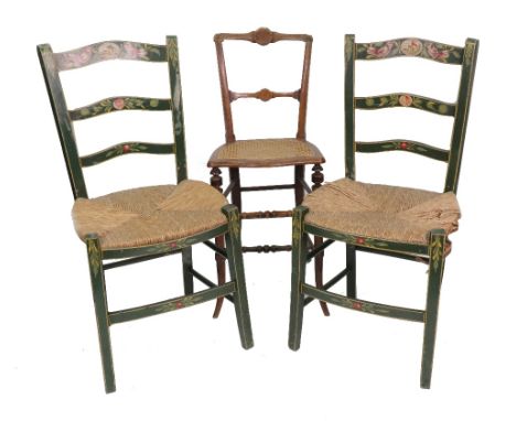 An early Victorian mahogany music chair, with bar back, cane seat, on splayed turned legs and a pair of painted and decorated