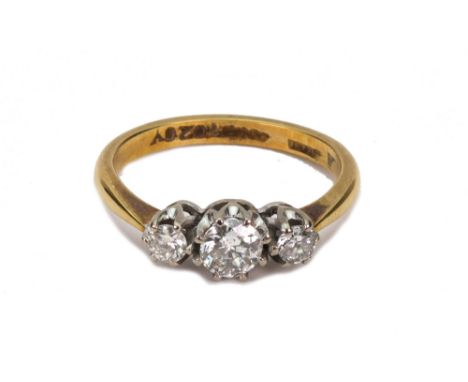 A diamond three stone ring, the round brilliants approx. 0.40cts, total, stamped '18ct' and '10207', ring size N/O, 3.5g gros