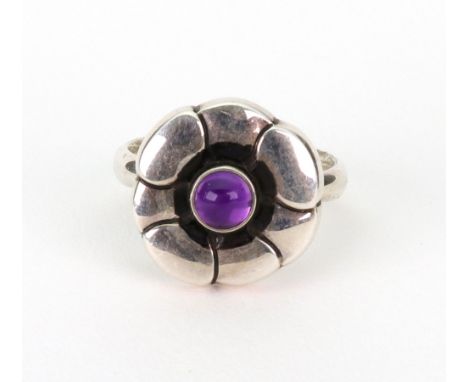 A Georg Jensen silver and cabochon amethyst ring, 'Moonlight blossom', no. 36, ring size N/O. Illustrated.