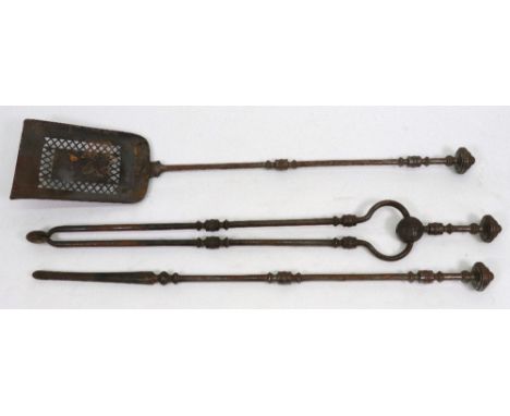 A set of three early 19th century steel fire tools, with ring turned cylindrical stems and turned finials, the shovel 75cm lo