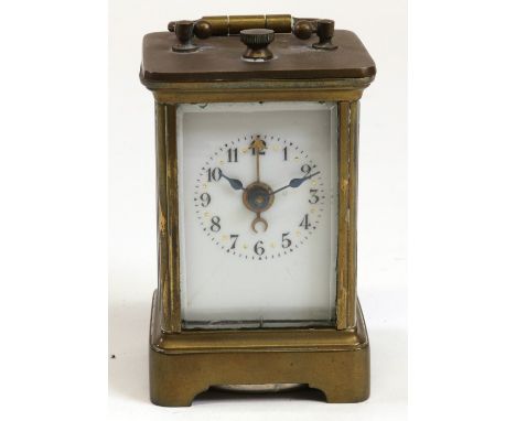 A miniature brass cased carriage clock, with alarm, late 19th century, the white enamel dial with Arabic numerals, 11cm high.