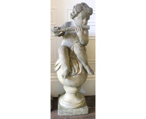A weathered pre-cast terrace figure of Pan playing a pipe, after the antique, seated on a sphere, 100cm high.