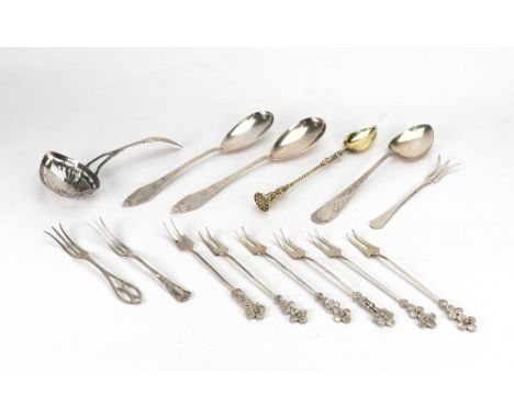 A Dutch silver foliate engraved and pierced sifter spoon, first half 19th century, a pair of fruit serving spoons, detailed 8