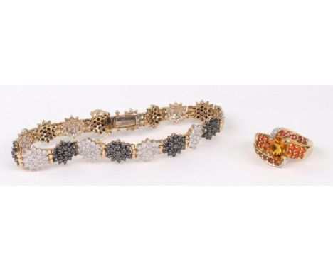 A 9ct gold, black and white diamond multi-flower-heads bracelet, post 2000 London convention marks, 13.4g gross; and a QVC 9c