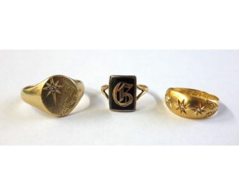 Three gold rings, comprising, an early 20th century 18ct gold and small diamond three stone gypsy ring, Birmingham 1914, ring