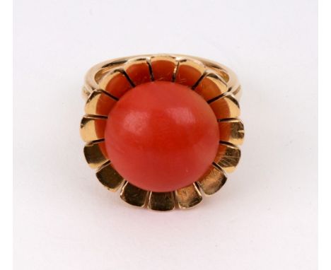 A cabochon coral and yellow metal flowerhead ring, stamped '750' ring size M, 14.5g gross.