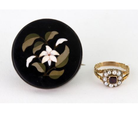 A 19th century gold, half-pearl and garnet oblong cluster ring with floral engraved split shoulders, ring size J+, in an Aspr