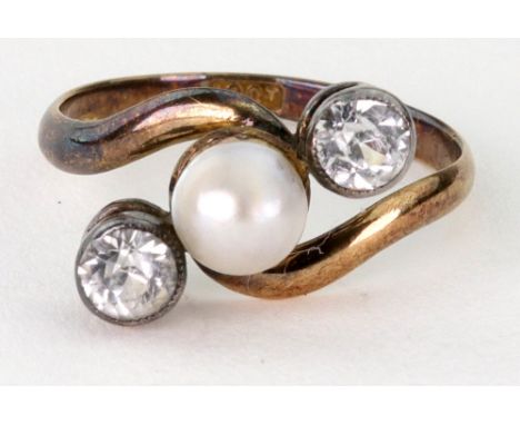 A cultured half-pearl and paste three stone cross-over ring, stamped '18ct', ring size L, 2.1g gross, a white metal and carne