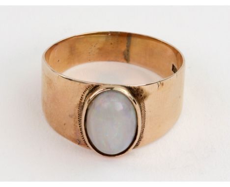 A rose gold and cabochon white opal ring, stamped '750', ring size V/W, 4.5g gross, boxed.