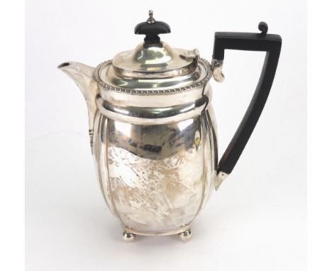 An Art Deco silver hot water pot, Charles Stuart Harris, London 1926, rounded rectangular with gadroon edge, black wood harp 