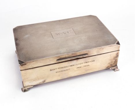 An Art Deco silver cigar box, J B Chatterley & Sons, Birmingham 1936, the hinged engine turned cover monogrammed, the front i