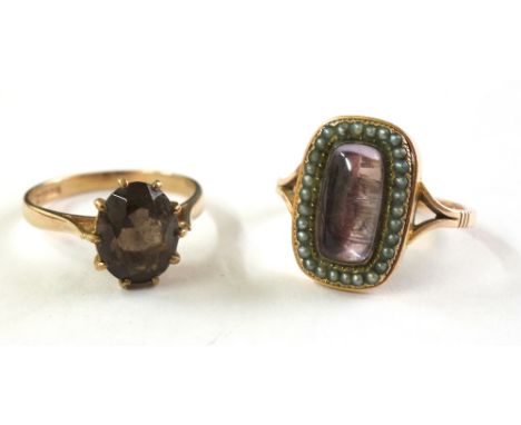 A 19th century gold oblong mourning ring, the pink-foil backed glazed panel within a half-pearl border and a 9ct gold and ova