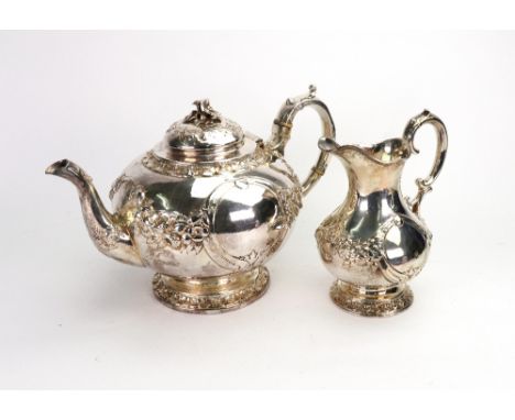 A Victorian silver bulbous circular teapot and matching milk jug, Henry Wilkinson, London & Sheffield 1861, retailed by Wordl
