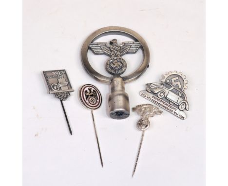 A collection of five Nazi related items to include:- DDAC enamel stick pin, an NSKK (German Motor Corps) Eagle stick pin, a R