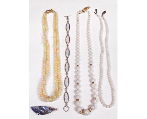 A graduated white opal bead necklace with yellow metal spacers and a reeded clip stamped '750'; a two row opal bead necklace 