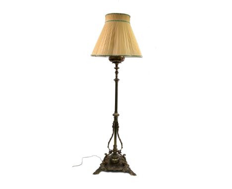 A Victorian brass oil standard lamp, circa 1870, in Gothic style, with knopped cylindrical column, having beaded scrolled sup