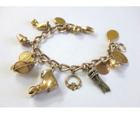 A late Victorian 9ct rose gold curb link watch chain later adapted as a 'charm' bracelet, Birmingham 1900; with a later bolt-