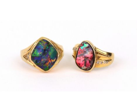 A boulder opal and diamond signet ring, fantasy-cut with diamond shoulders, stamped '750' and another similar stamped '18k', 