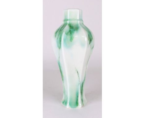 A Royal Doulton Chinese Jade vase by Charles Noke and Harry Nixon of baluster hexagonal shape on a flared base, with green ve