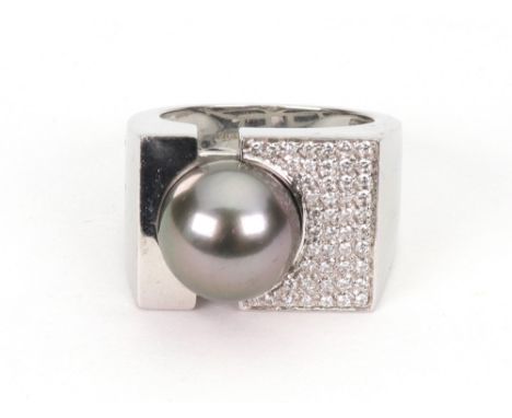 A grey cultured pearl and diamond abstract dress ring, the 11-11.5mm bead flanked by polished metal and pave diamond settings