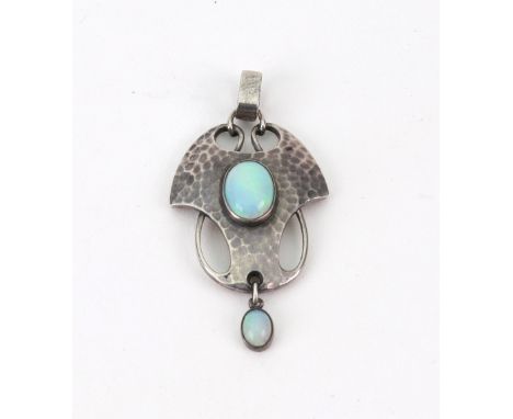 An Art Nouveau silver and cabochon opal pendant by Murrle Bennett & Co, (1896-1914), 40mm long, 4.1g gross. Illustrated.