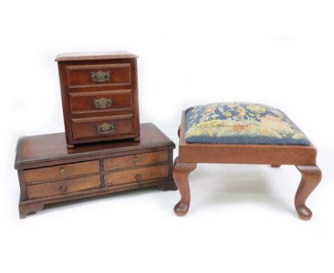 A mahogany table top chest, reconstructed, elements 19th century, with four small drawers, having stained pine sides, a repro