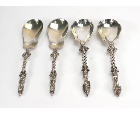 A pair of Victorian cast silver 'apostle' spoons, Edward Beresford, London 1884, with angel mask and entwined pierced stems, 