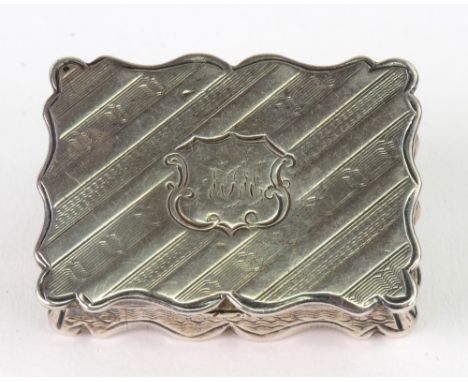 A Victorian silver engine turned rectangular vinaigrette, Frederick Marson, Birmingham 1846, of shaped outline, the hinged co