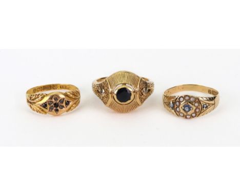 A 15ct yellow gold and pale blue sapphire ring, Chester 1883, a 15ct yellow gold, rose-cut diamond and ruby ring, Birmingham 