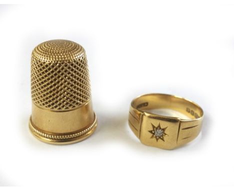 An 18ct yellow gold and old-cut diamond set signet ring, Birmingham 1934, 4.5g gross, and a gold thimble, stamped '10 14', 8.