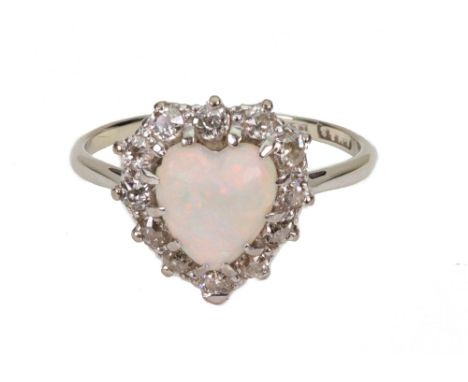 A heart shaped cabochon white opal and diamond cluster ring, early 20th Century, the shank stamped 18ct, 3.7g gross, ring siz