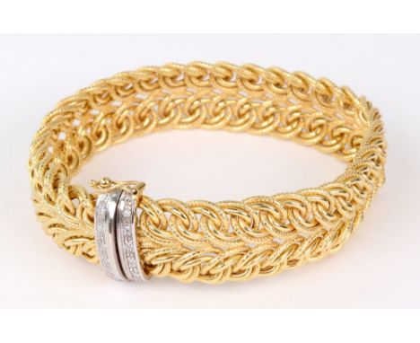 A 9ct gold fancy textured inter-woven hoops broad bracelet, with small round brilliant diamond five-stone white-gold panel te