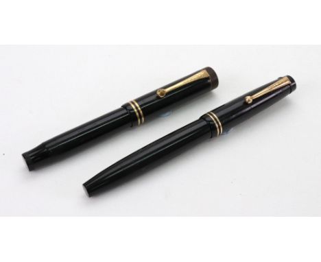 A vintage Parker Victory black and gilt fountain pen and a Geo S Parker Duofold Jr Lucky Curve fountain pen, black and gilt (